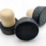 three black Wooden Whiskey Bottle Tops